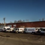 Long view of L&R Installations vans and office location