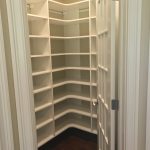 Small closet with all around shelving
