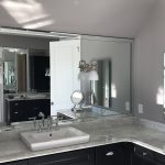 Corner of grey and marble bathroom