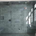 Deep gray tiled and marble shower for two