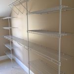 White wire shelving on beige wall