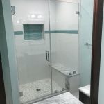 White, marble and aqua tiled shower