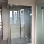 Glass enclosed beige shower